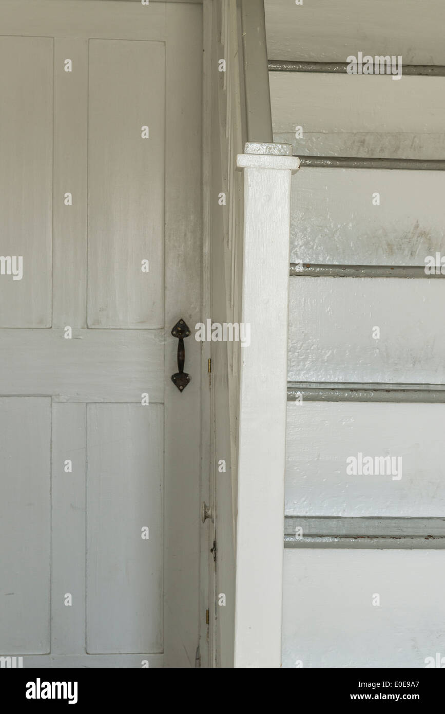 Door and stair detail in old rural home. Stock Photo