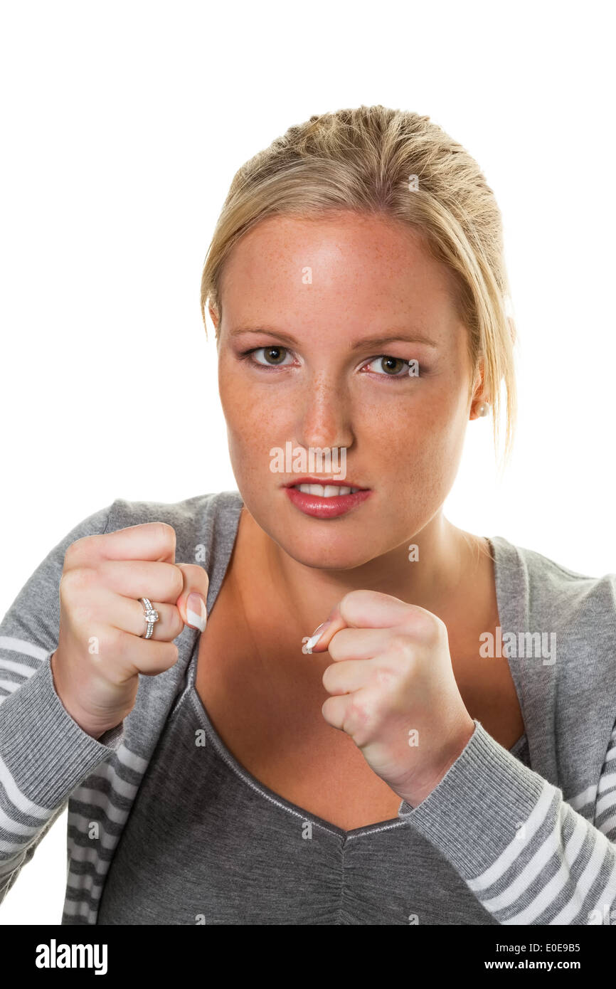 A young woman in the box position is ready to fight. Quarrel and problems in marriage and partnership, Eine junge Frau im Boxhal Stock Photo