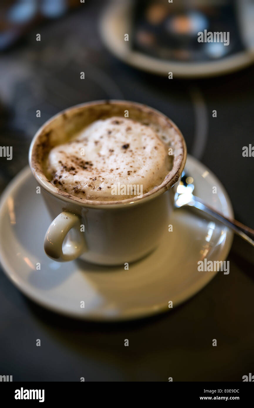 Cup of cappuccino in a cafe. Stock Photo