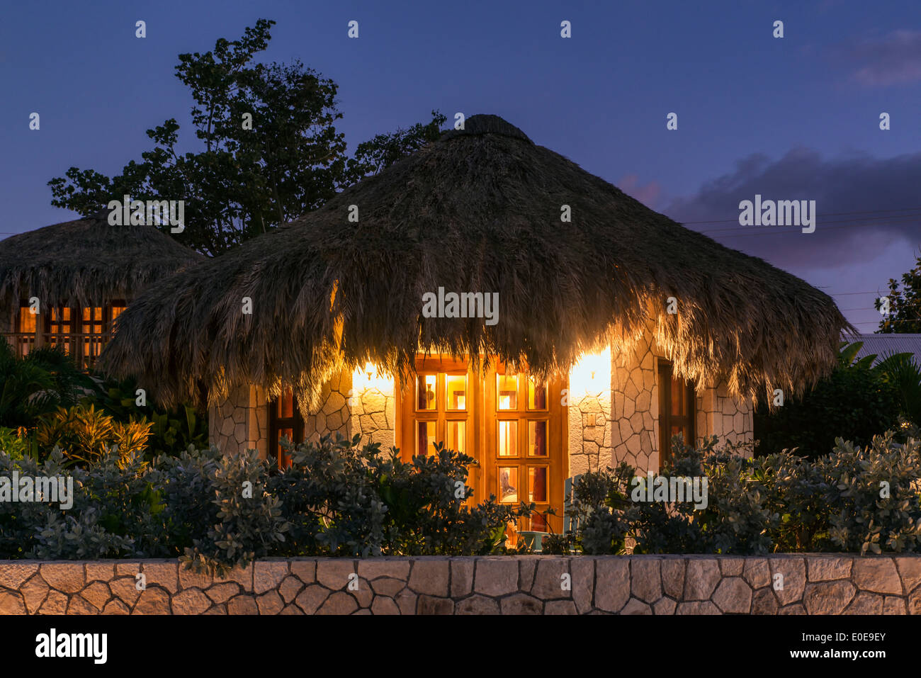 Boutique Hotel Cottages With Thatched Roof At Night Negril
