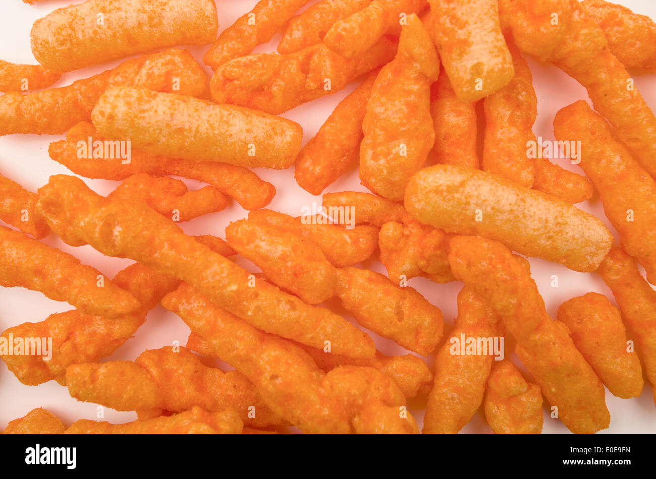 orange cheese flavoured snacks Stock Photo Alamy