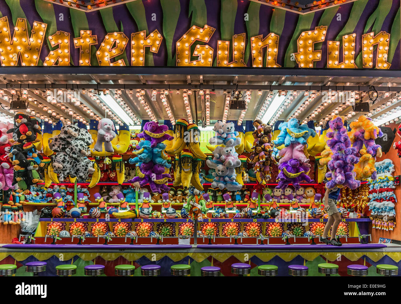 Stuffed animals prizes at a carnival booth water gun game. Stock Photo