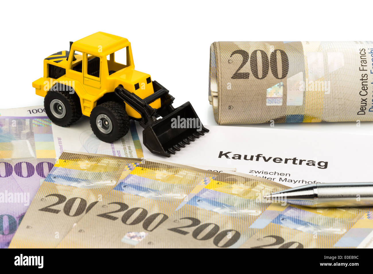 A bill of sale for new excavator. Invest in new vehicles brings cost advantages. With Swiss Franconia, Ein Kaufvertrag fuer neue Stock Photo