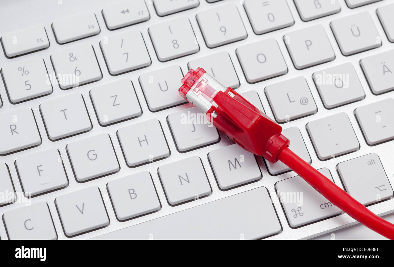 Keyboard and cable Stock Photo - Alamy