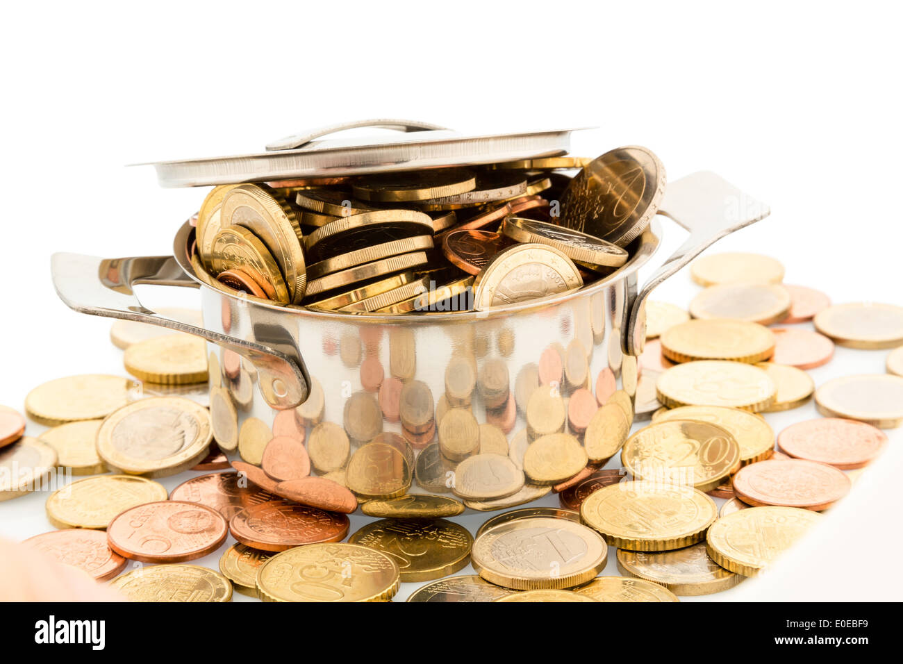 A saucepan is filled with eurocoins, symbolic photo for conveyor money, Ein Kochtopf ist mit Euromuenzen gefuellt, Symbolfoto fu Stock Photo
