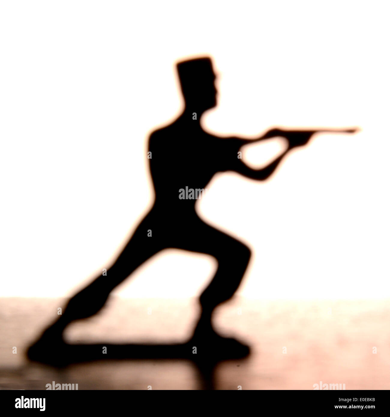 Soldier figurine firing a gun Stock Photo