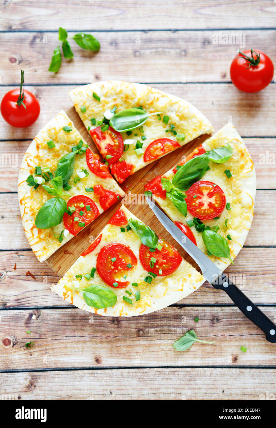 pizza with tomato and cheese, food closeup Stock Photo