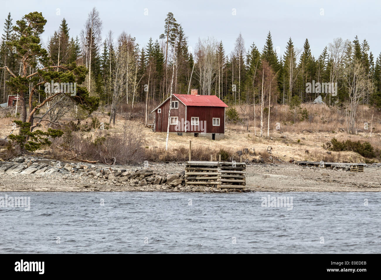 Old wooden cabin by the lake Stock Photo