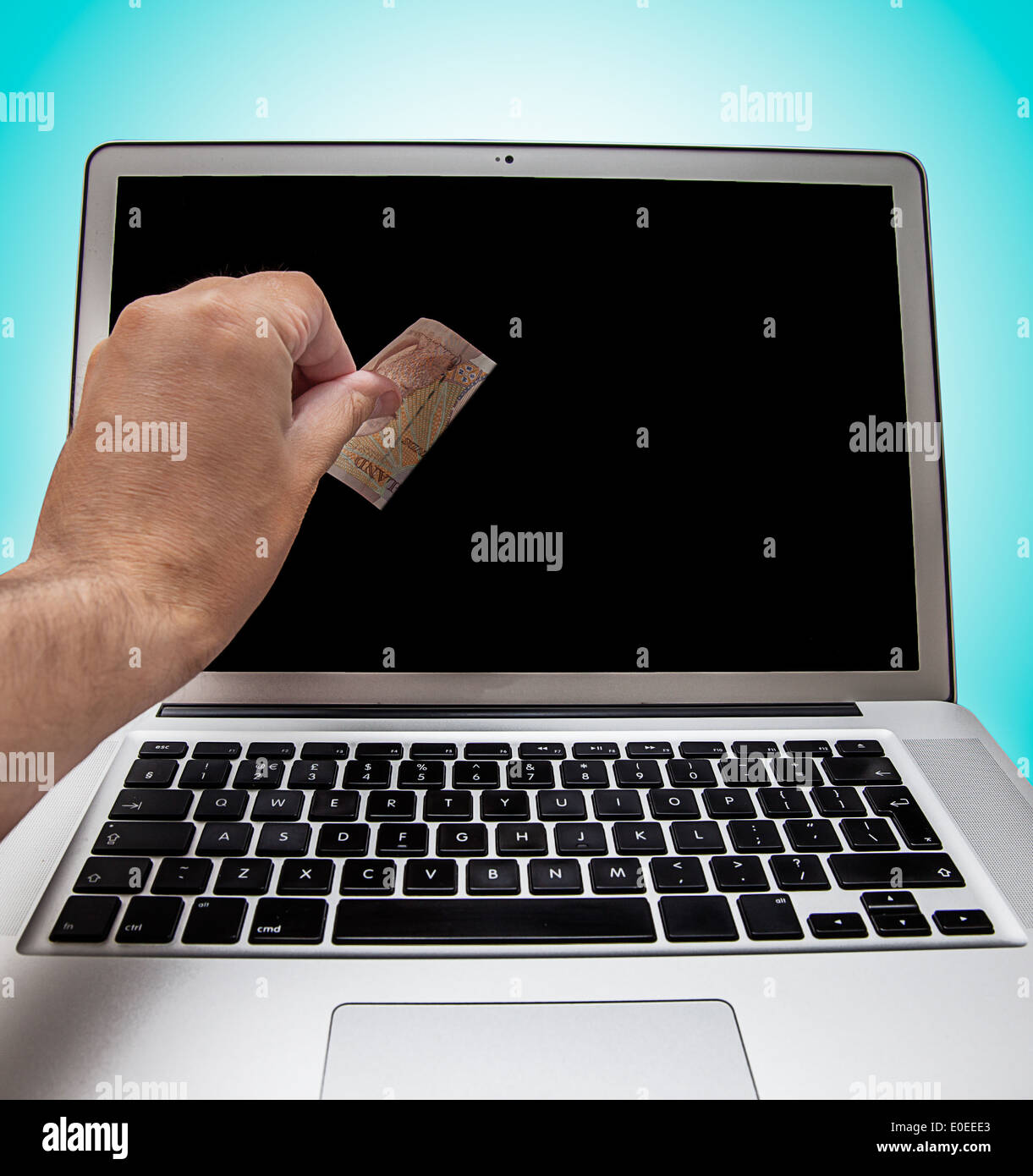 Cyber theft concept shot with laptop and money Stock Photo