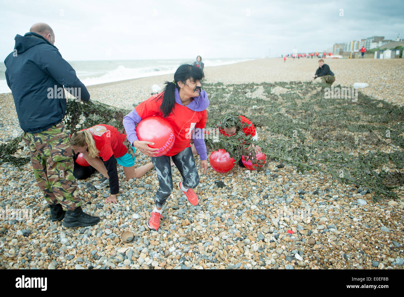 Hove Lagoon, City of Brighton & Hove, East Sussex, UK. Brighton Big Balls Beach Run 2014. This a charity event raising funds for cancer research for prostate and testicular cancer research. David Smith/Alamy Live News Stock Photo