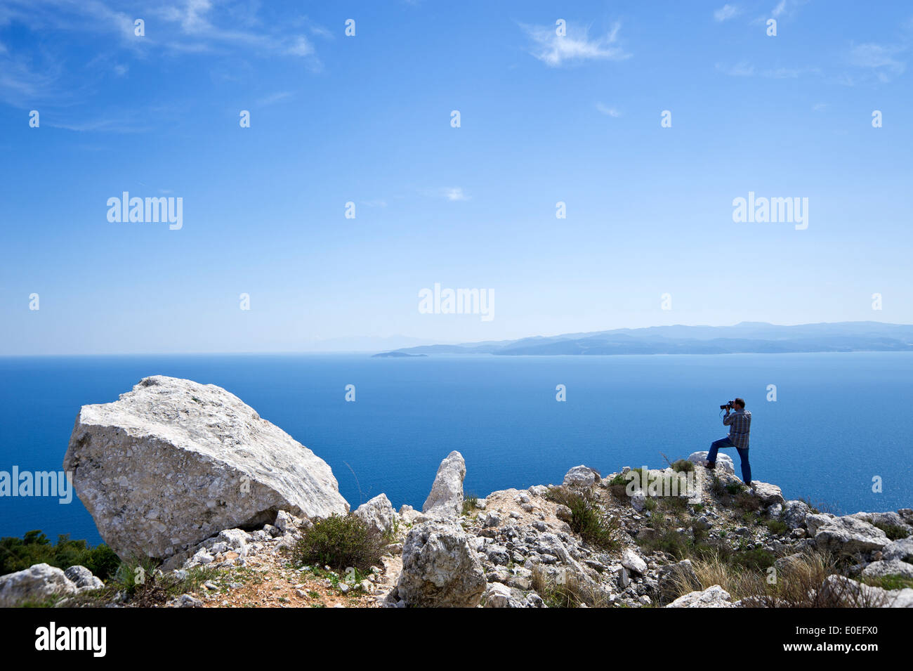 Seascape with solitary photographer Stock Photo