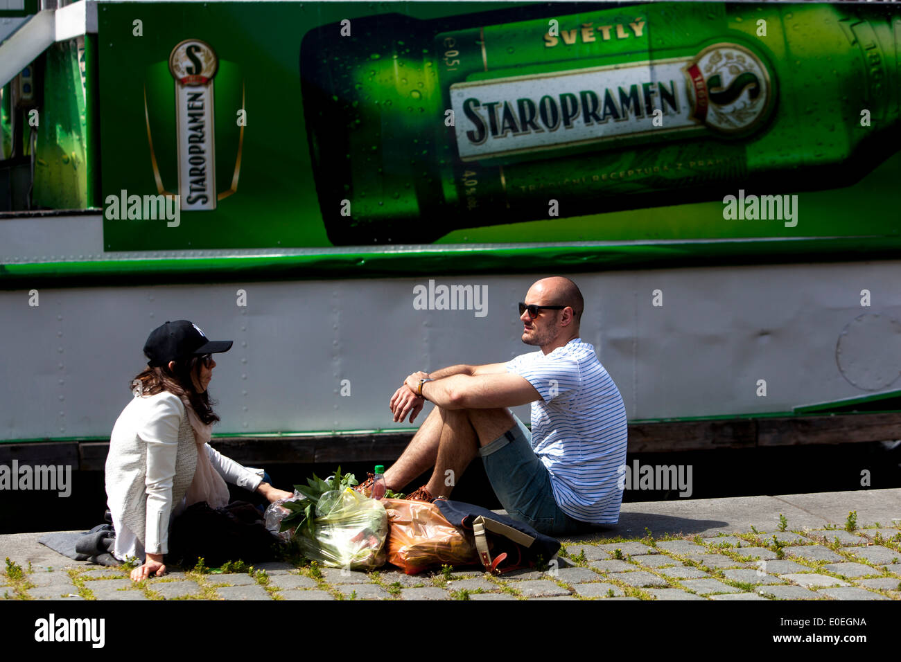 A picnic on the waterfront Advertisements for beer Staropramen Prague Czech Stock Photo