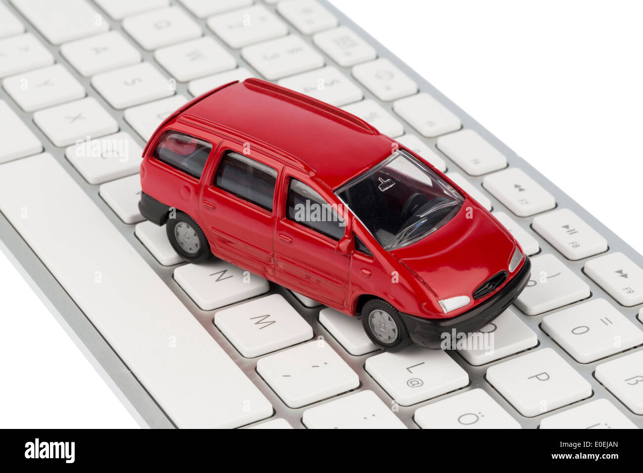 Car on keyboard, symbolic photo for autopurchase and automobile business on the Internet, Auto auf Tastatur, Symbolfoto fuer Aut Stock Photo