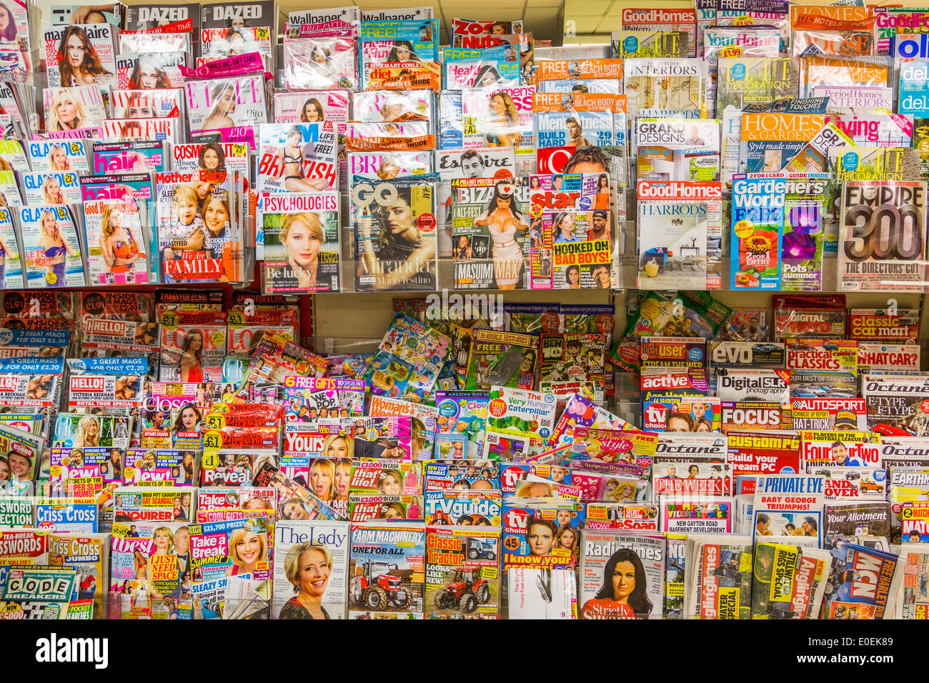 A selection of lifestyle magazines for sale in a newsagent shop London England UK Stock Photo