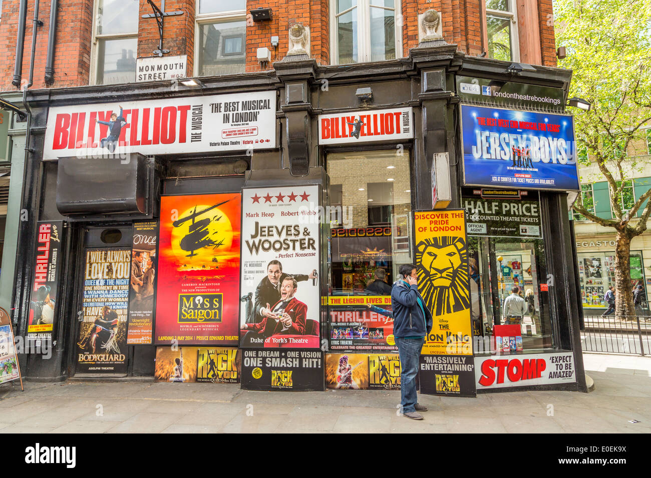Theatre Advertising hoardings on a corner shop on Monmouth Street London WC2 Stock Photo