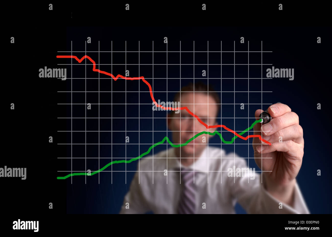 Businessman hand drawing a virtual chart on a clear screen. Stock Photo