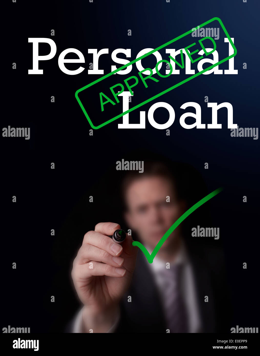 An underwriter writing Personal Loan approved on a screen. Stock Photo