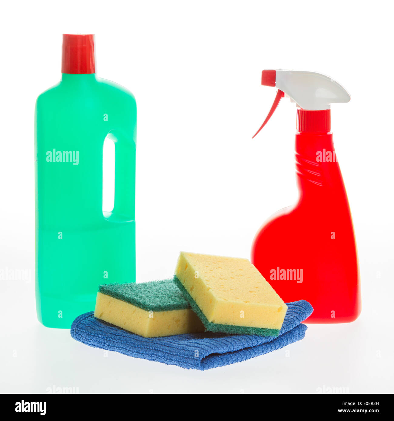 House cleaning product. Plastic bottles with detergent and sponge isolated on white background Stock Photo