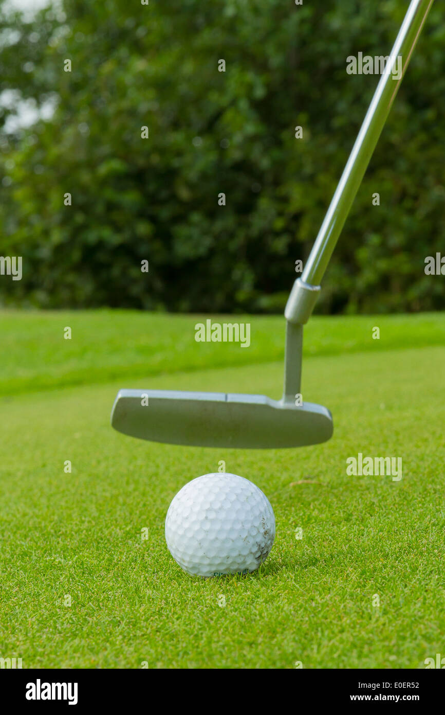 Golf ball on front of a driver at driving range Stock Photo - Alamy