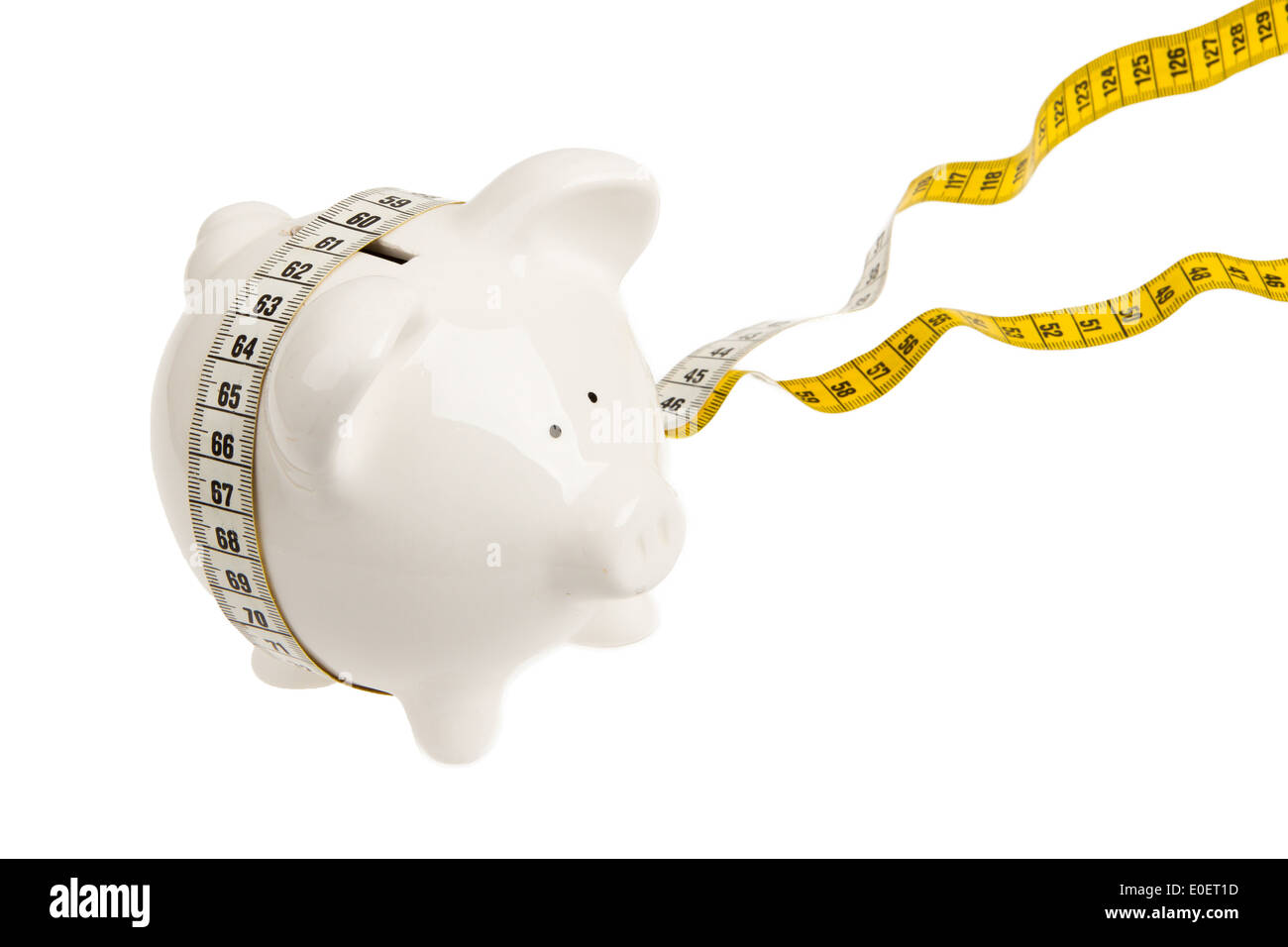 White piggy bank with measuring tape on white background Stock Photo ...