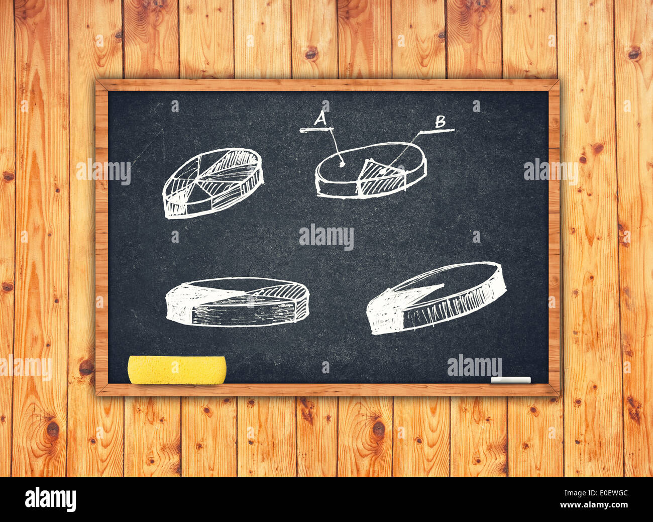 Pie charts and other infographics on chalkboard. Concept of presenting information with charts. Stock Photo
