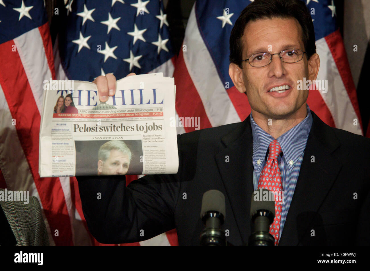 US House Minority Whip Eric Cantor holds a press conference holding up a copy of the Hill Newspaper headline on Nancy Pelosi November 17, 2009 in Washington, DC. Stock Photo