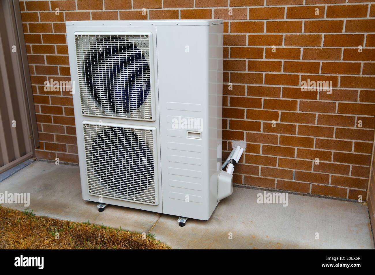 Installation of air conditioner hires stock photography and images Alamy