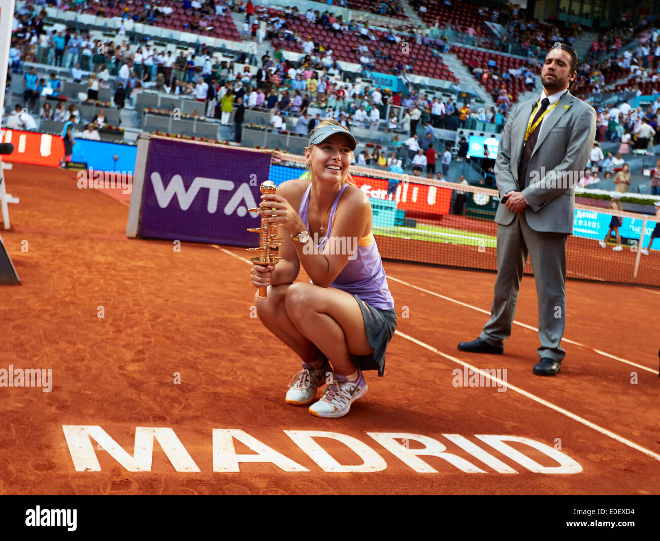 Madrid, Spain. 11th May, 2014. Maria Sharapova of Russia poses with the WTA Mutua Madrid 2014 trophy on the Madrid Logo after winning the 2014 final against Simona Halep of Romania from La Caja Magica. Credit:  Action Plus Sports/Alamy Live News Stock Photo