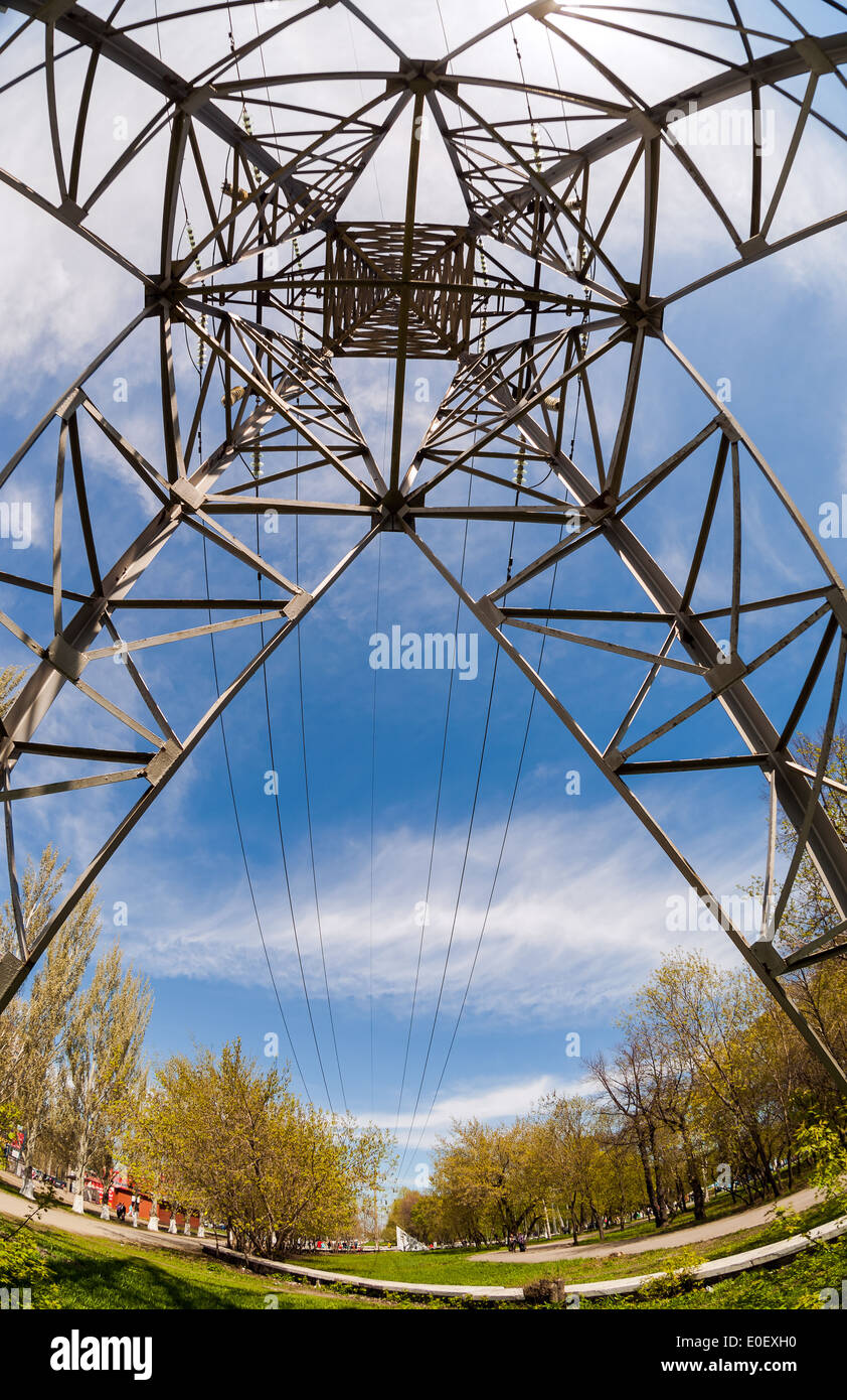 High voltage electric tower against blue sky Stock Photo - Alamy