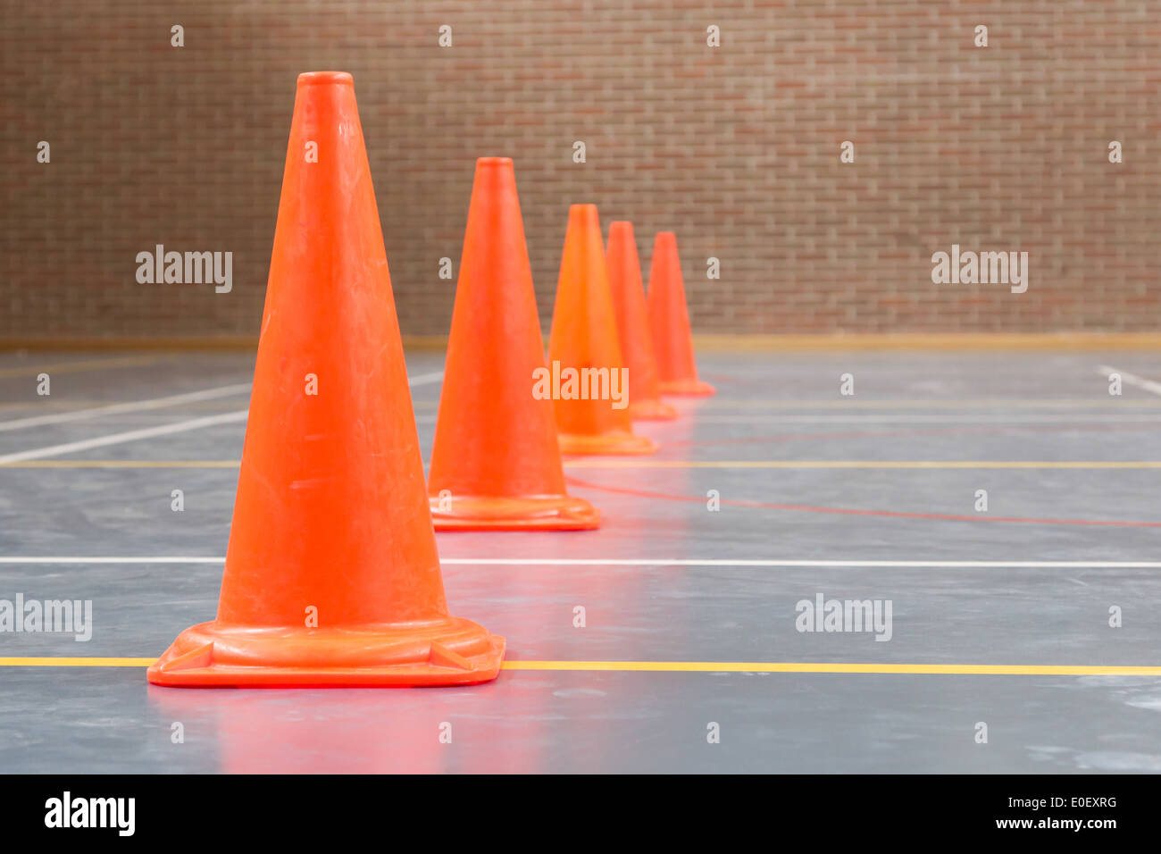 Interior of a gym at school, red cones on a row Stock Photo