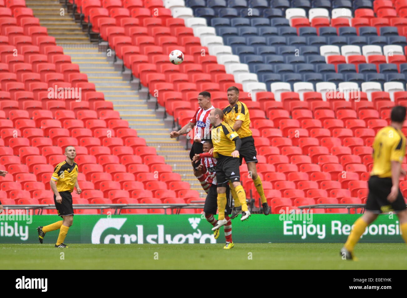 London, UK. 10th May, 2014. Midfield tussle as Sholing Town FC and West Auckland Town FC compete during the FA Vase final at Wembley Stadium on the 10th May 2014. Credit:  Flashspix/Alamy Live News Stock Photo