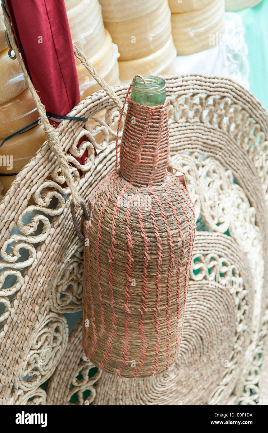 wicker bottle with cheese for an appetizer Stock Photo