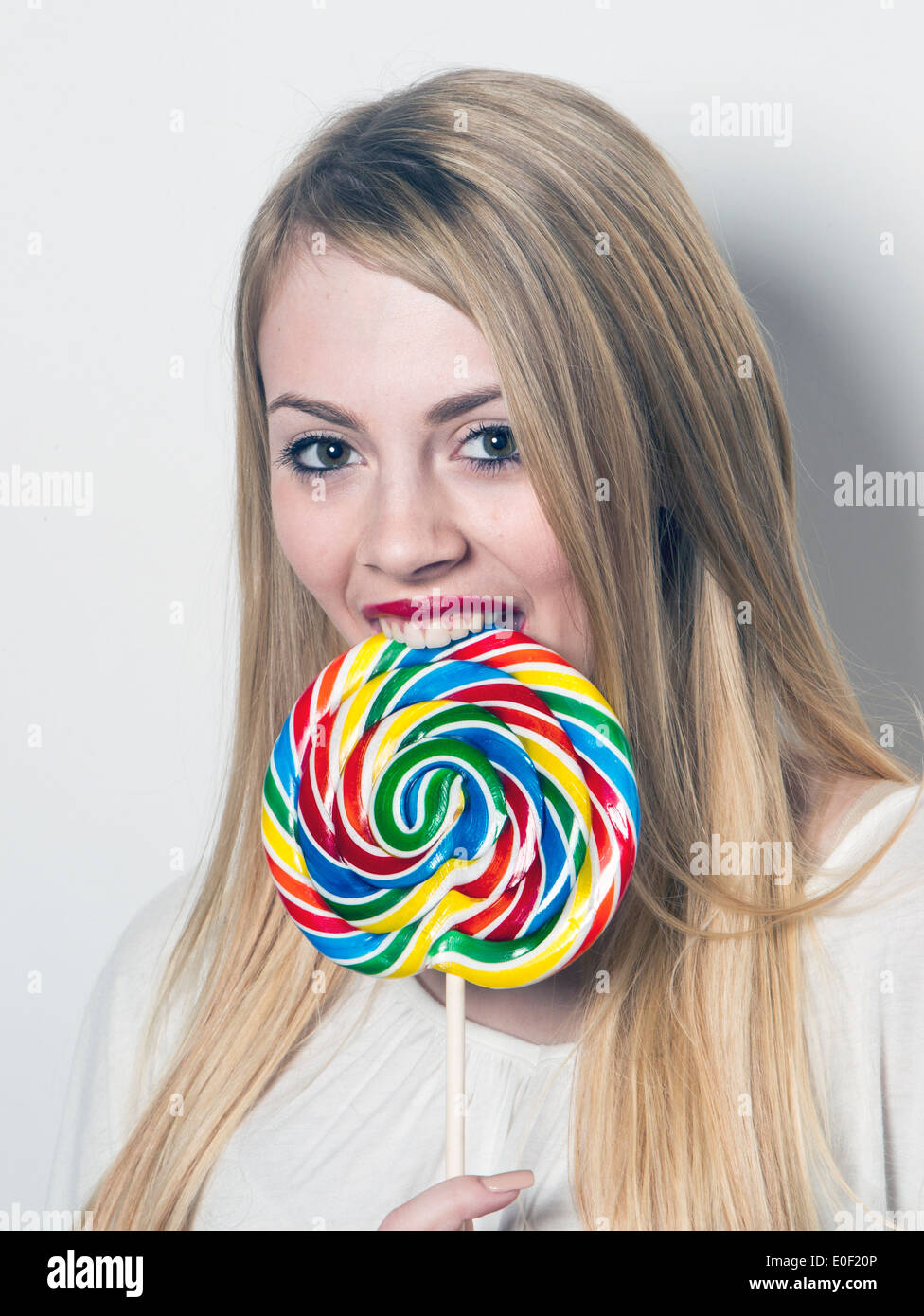 Teenage girl eating lollipop hires stock photography and images Alamy