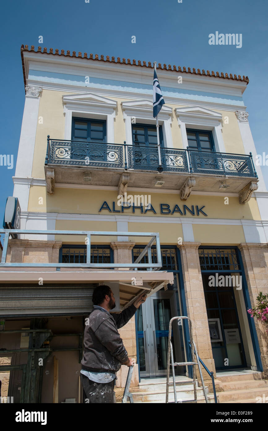 alpha bank cash money dispenser person bank greece Stock Photo