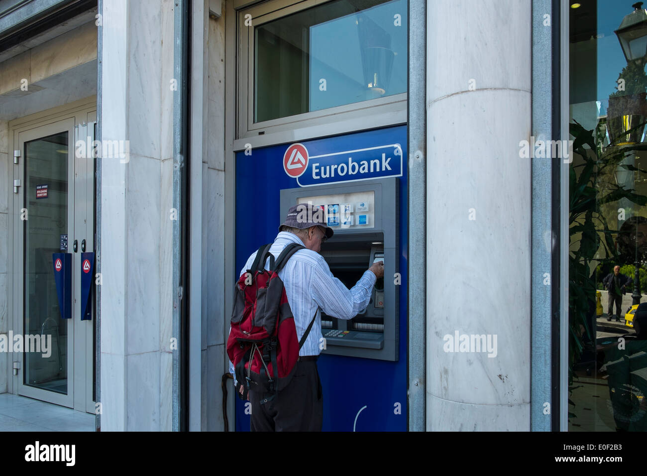 eurobank cash money dispenser person bank greece Stock Photo