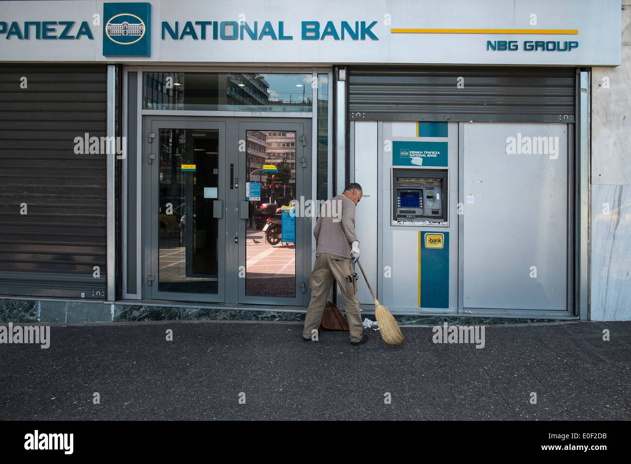 national bank cash money dispenser person greece Stock Photo