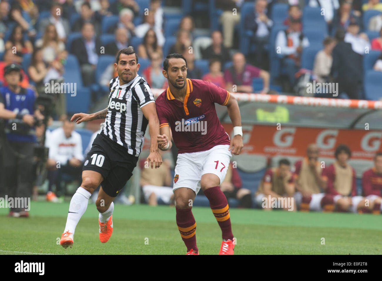 Rome, Italy. 11th May, 2014. Benatia (AS Roma - R) and Carlos Tevez (Juventus FC - L) during the Serie A match between AS Roma and FC Juventus on May 11, 2014, at Rome's Olympic Stadium. Credit:  Manuel Romano/NurPhoto/ZUMAPRESS.com/Alamy Live News Stock Photo