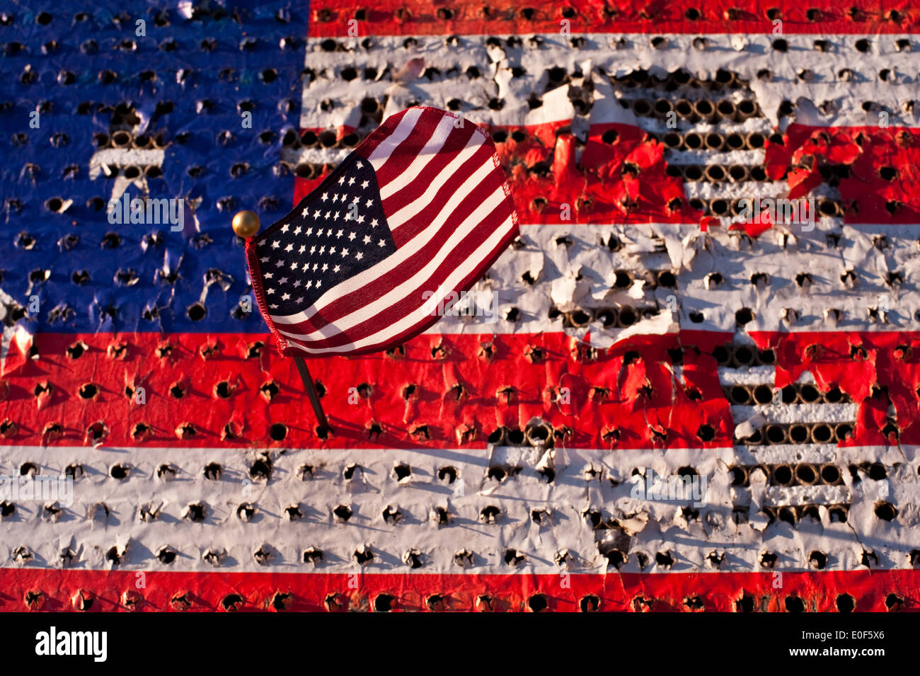 Fourth of July with American flag damaged by fireworks Stock Photo - Alamy