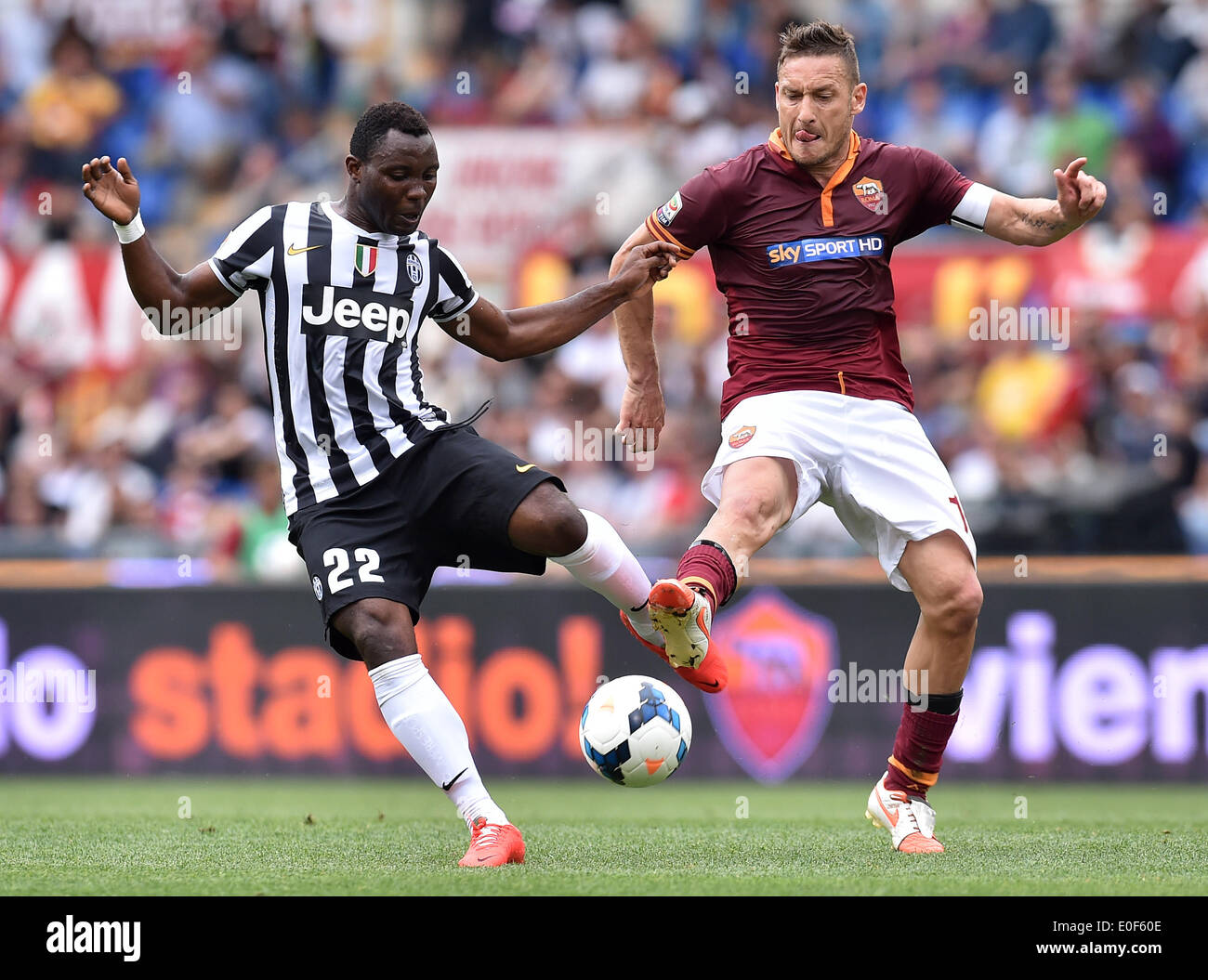 Rome, Italy. 11th May, 2014. Kwadwo Asamoah (L) of Juventus vies with Francesco Totti of Roma during their Italian Serie A soccer match in Rome, Italy, on May 11, 2014. Roma lost 0-1. Credit:  Alberto Lingria/Xinhua/Alamy Live News Stock Photo