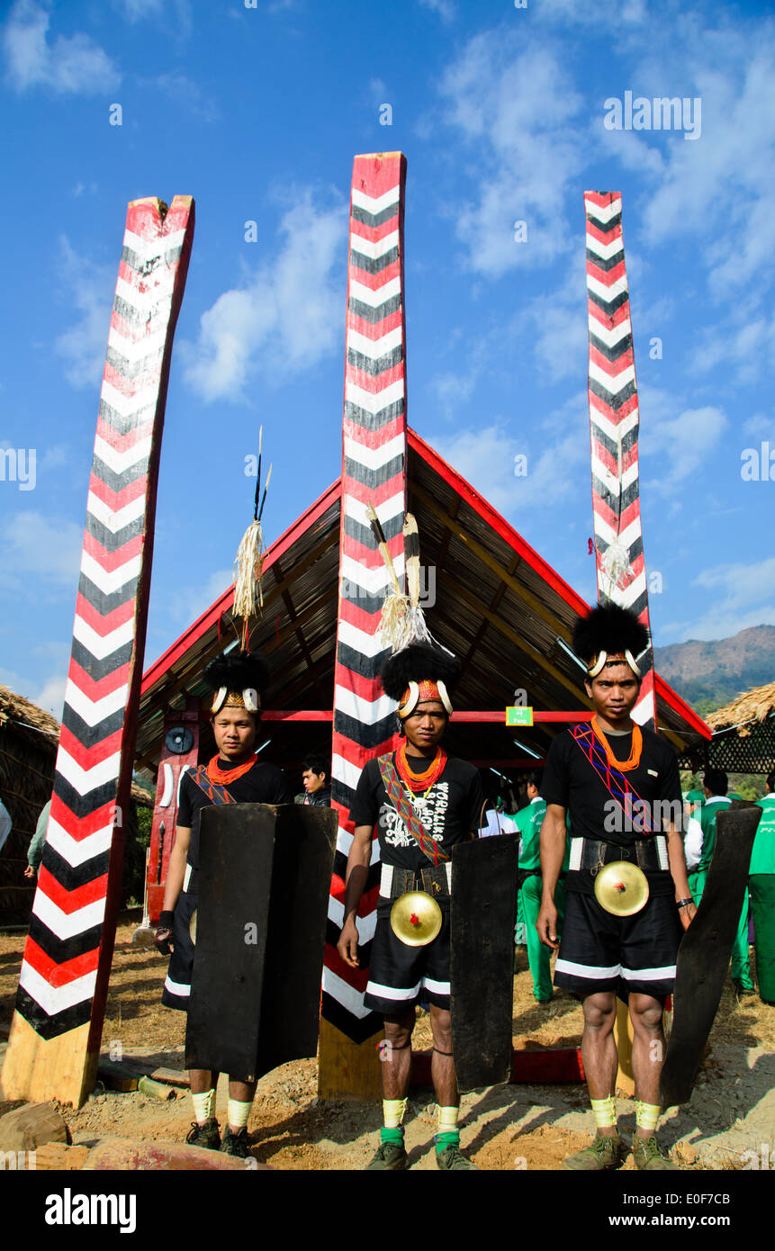 Naga men in front of the poles representing all the groups Stock Photo