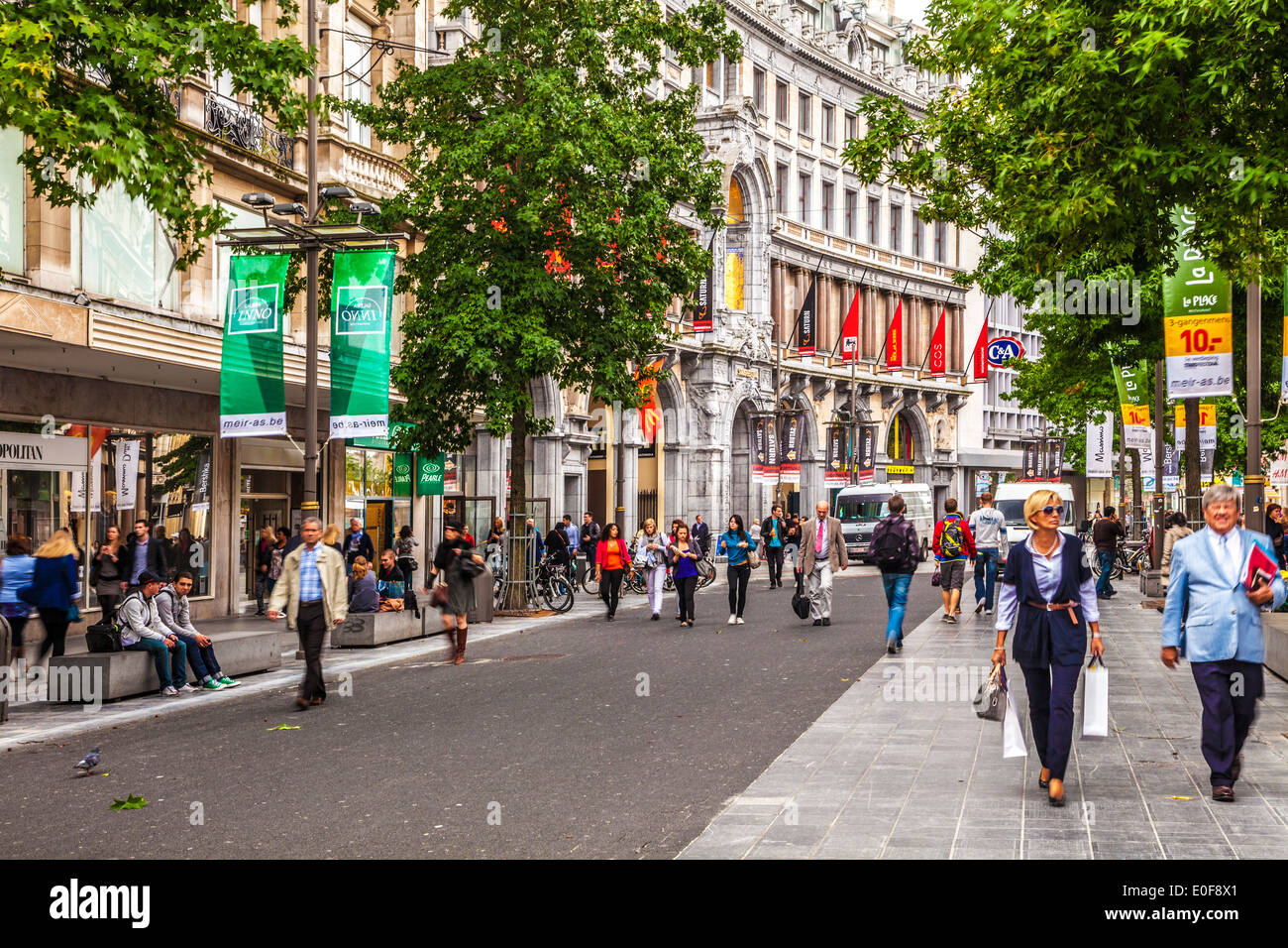 Shoppers hurrying along Meir, the largest pedestrianised shopping street in Antwerp. Stock Photo