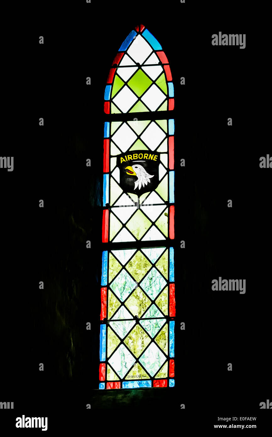 Stained glass window honouring the 101st airborne division in a church in Angoville du Plain, Normandy, France Stock Photo