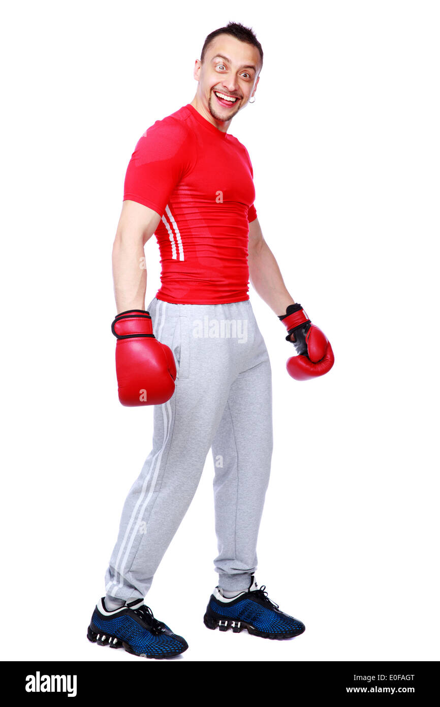 Funny sportsman in boxing gloves standing over white background Stock