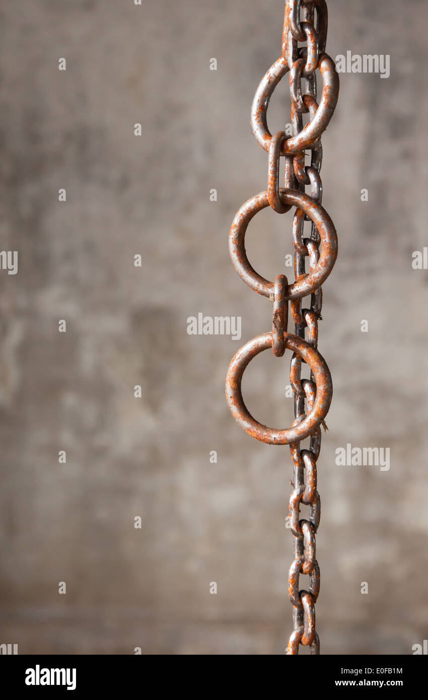 Old weathered industrial chain with rings, industrial setting Stock Photo
