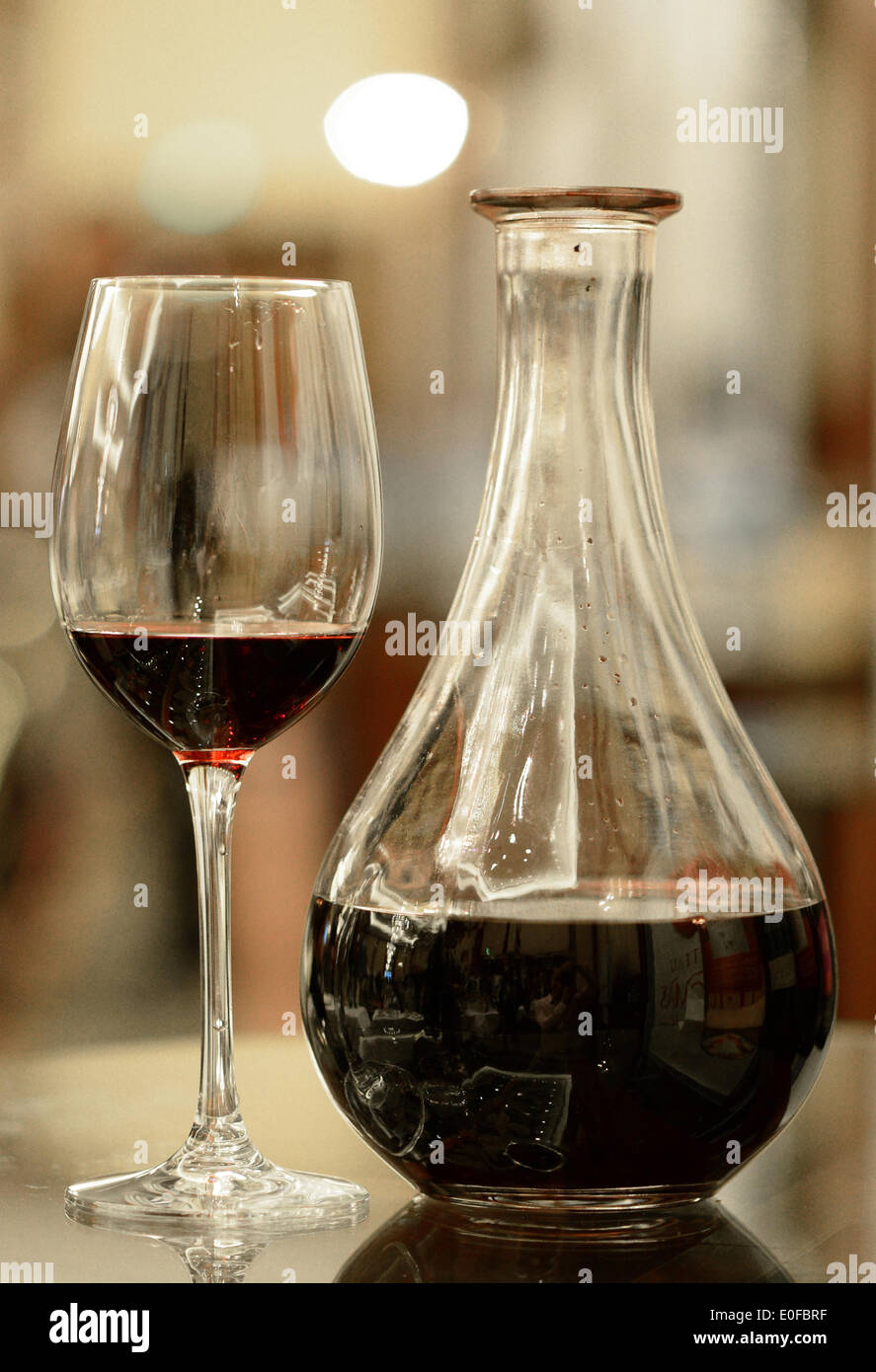 Berlin, Germany. 05th May, 2014. A glass of red wine stands next to a