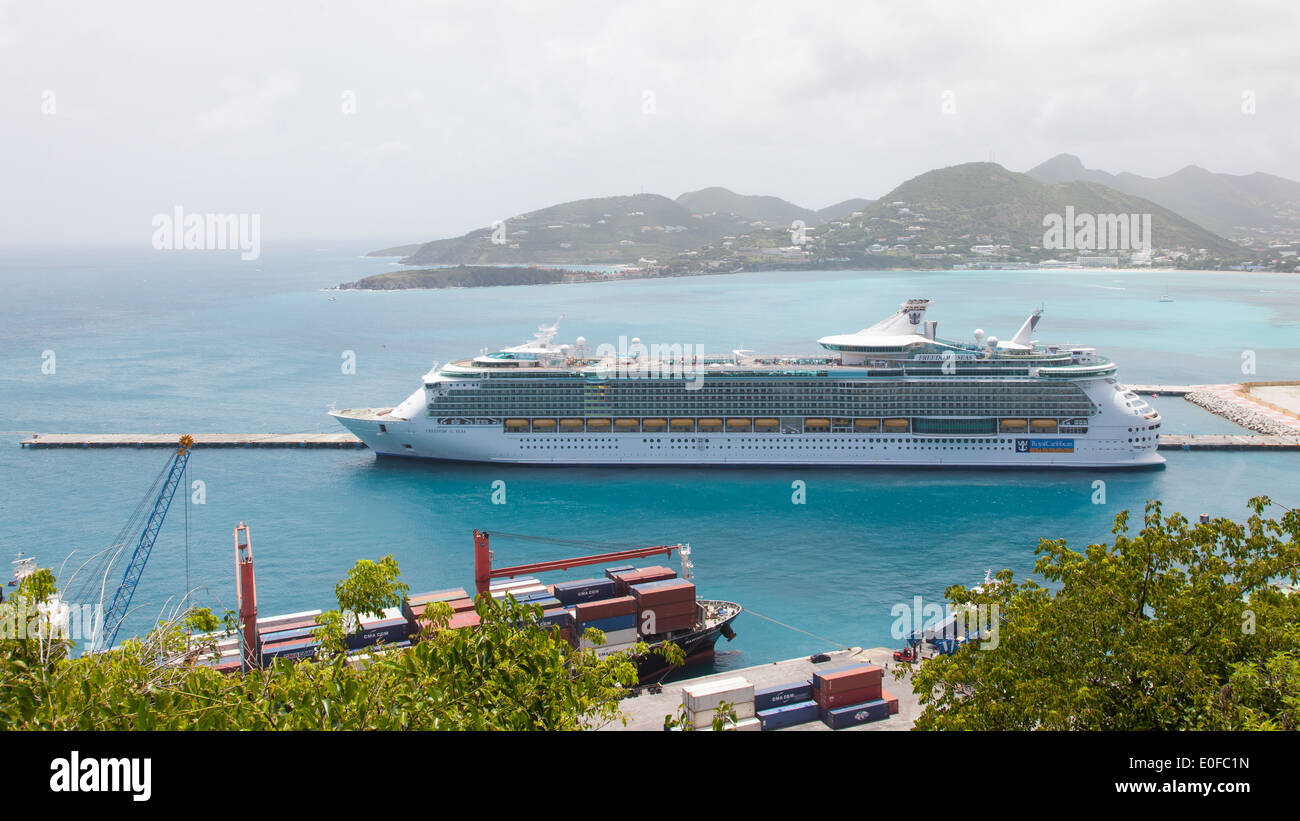 ST MARTIN ANTILLES - JULY 18 2013: Cruise ship Freedom the Seas anchored at St. Martin on July 18 2013. Passengers have to be Stock Photo