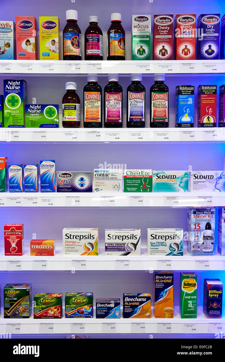 Cold and Flu remedies and medicines in a Pharmacy or chemist's shop. Stock Photo