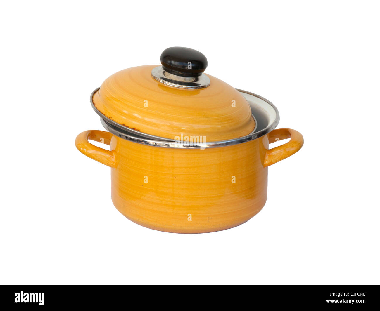 Old yellow metal cooking pot isolated on white Stock Photo