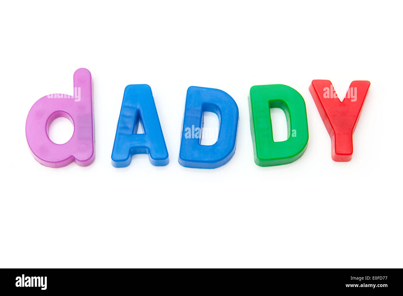Daddy written in magnetic letters isolated on a white studio background. Stock Photo