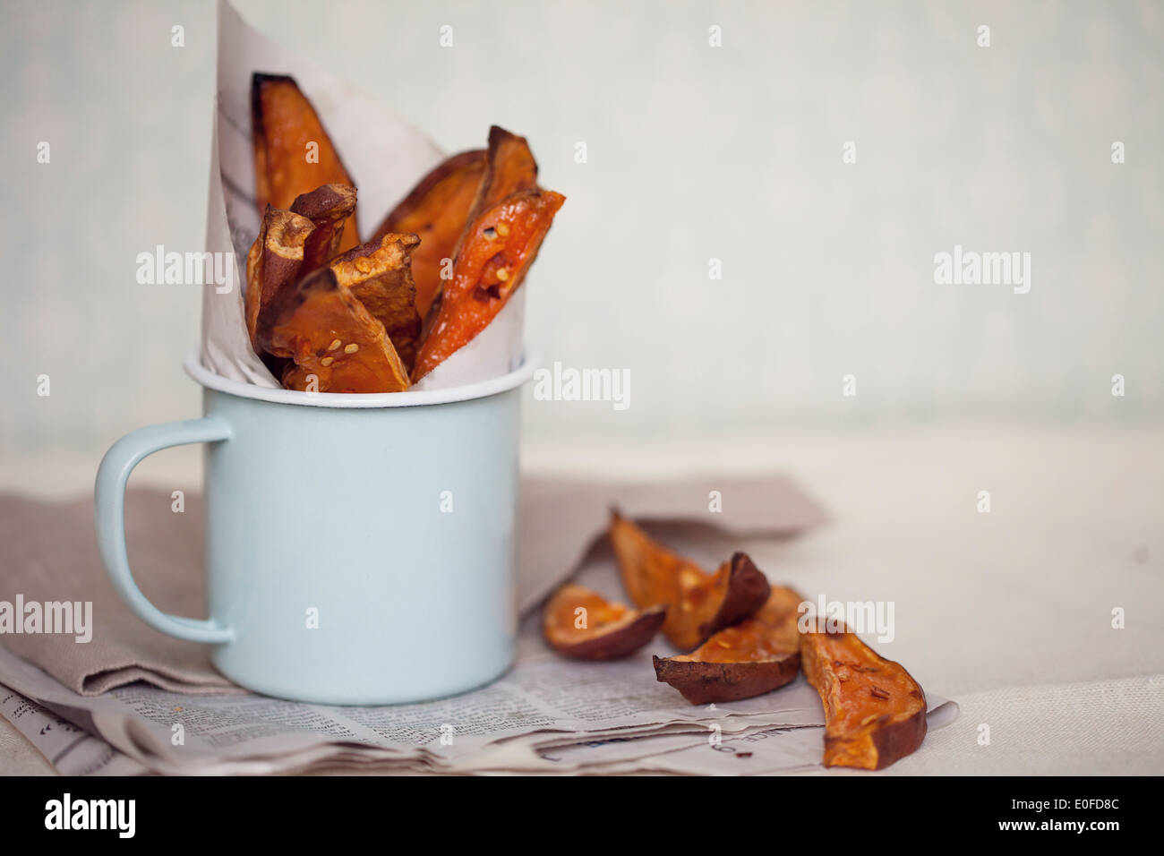 Sweet Potato Wedges with Chilli in a serving cup Stock Photo